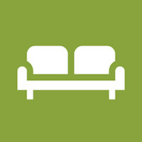 Piktogram for grovavfall, hvit sofa på grønn bakgrunn